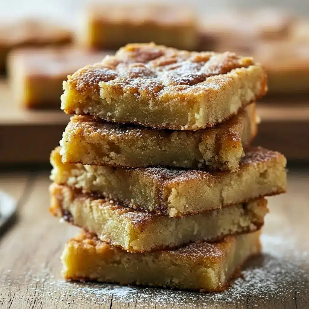 A stack of chewy cinnamon sugar blondies with a golden crust, perfect for Afternoon Dessert Ideas, Quick Fall Treats, or Desserts To Give To Neighbors.