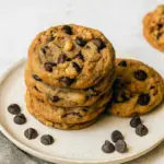 Stack of chewy Bourbon Butter Cookies with gooey chocolate chips, golden edges, and rich bourbon flavor, the perfect boozy twist on a classic chocolate chip cookie.