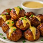 Golden-brown Korean BBQ meatballs glazed with a sticky soy-gochujang sauce, sprinkled with sesame seeds and scallions — a mouthwatering Beef Dinner idea for fans of Meatball Recipes Easy and Asian Cooking, perfect for quick Yummy Dinners.