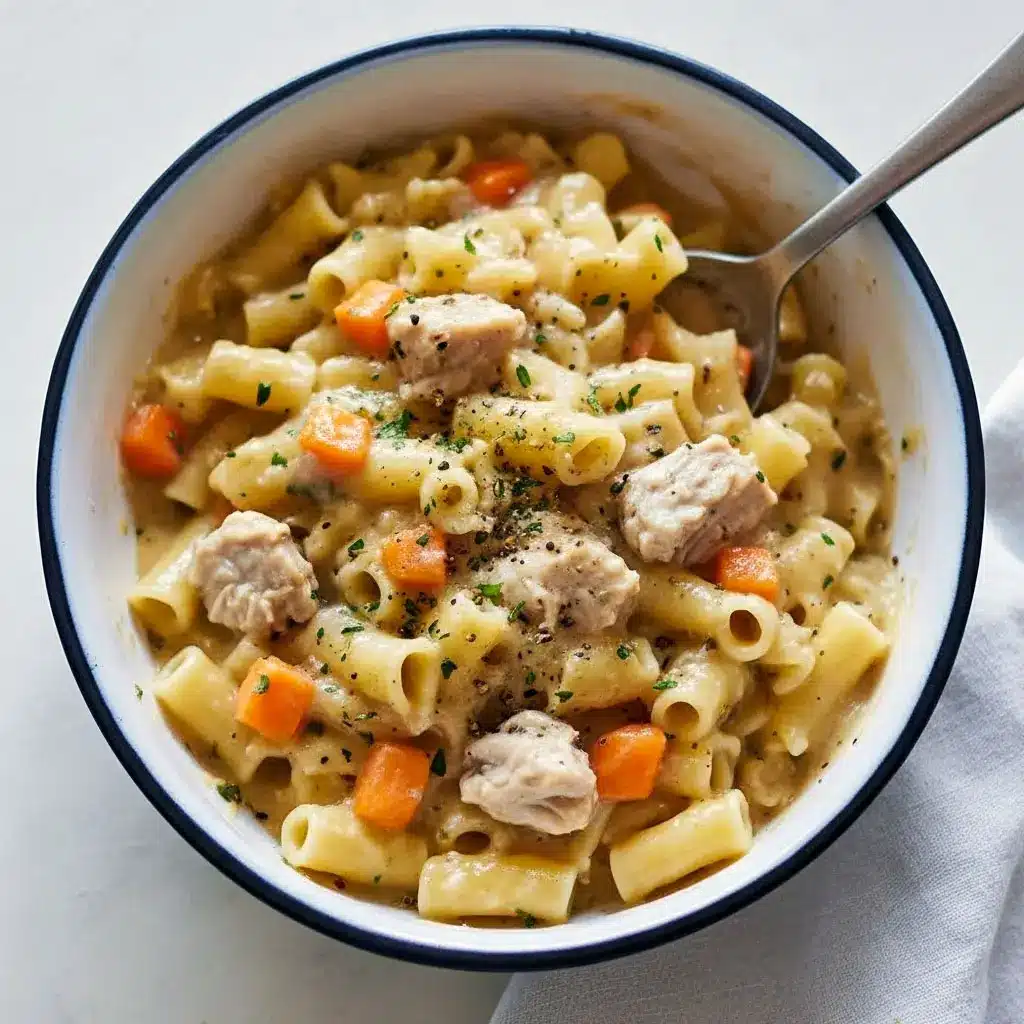Bowl of Creamy Chicken Pot Pie pasta with egg noodles, shredded chicken, and veggies in a rich sauce — a cozy comfort food favorite for Pasta Dinner Recipes, perfect One Pot Meals, and easy Chicken Dinner Recipes nights.