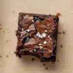 Decadent Coffee Chocolate Dessert — close-up of a brown butter espresso brownie square with a glossy crackle top and gooey center on parchment, a top pick for Brownie Dessert Recipes.