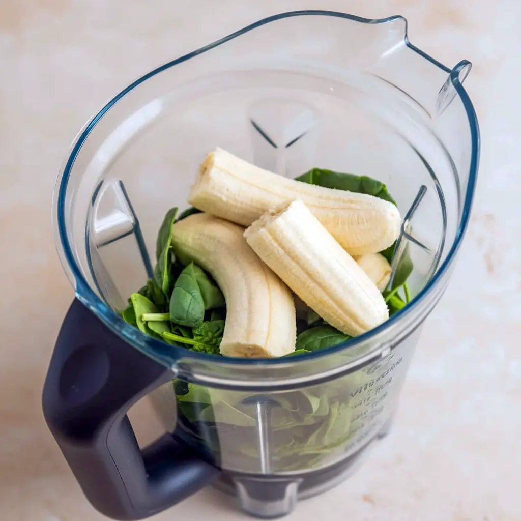 Chocolate Spinach Muffins: close-up of a moist chocolate muffin with chocolate chips, hiding spinach for a nutritious twist — great for Healthy Toddler Snack Ideas.