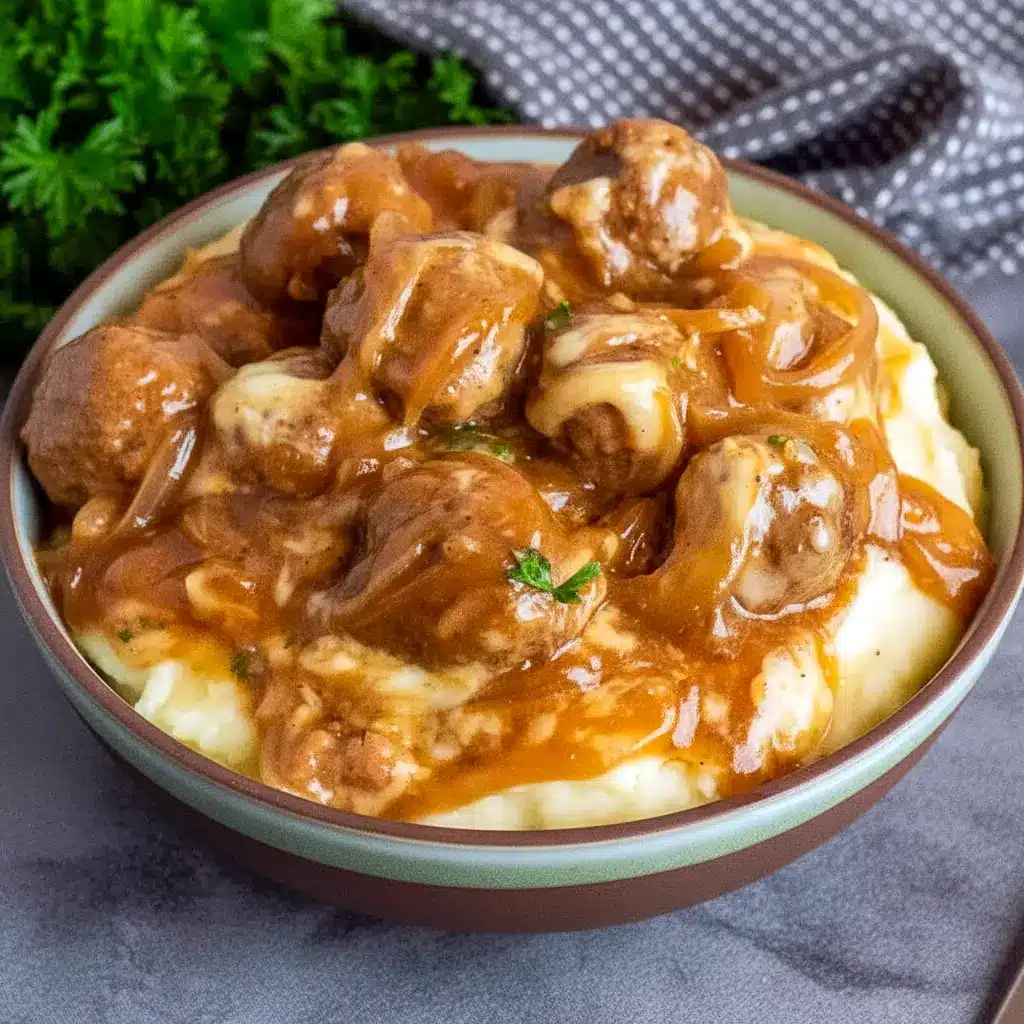 Crock Pot French Onion Meatballs topped with melted cheese in a slow cooker — perfect Crockpot Party Food Crowd Pleasers.