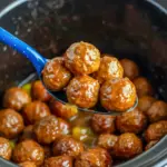 A serving of Crock Pot Mississippi Meatballs with glossy sauce and pepperoncini peppers, styled as Slow Cooker Mississippi Meatballs for an easy comfort food dinner.