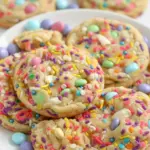 Close-up of Easter Cookies — pastel M&M-studded, white-chocolate pockets and sprinkle-topped rounds, a cheerful Easter Bakery Desserts option for spring parties and gift boxes.