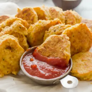 A plate of golden Chickpea Vegetable Nuggets served with dipping sauce, showing a crispy Kids Veggie Nuggets Recipe that looks healthy, simple, and kid-friendly.