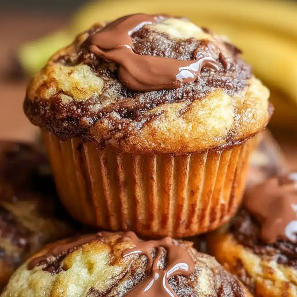 A tray of Nutella Banana Swirl Muffins with glossy bakery-style tops, styled as a sweet example of How To Make Nutella Swirl Muffins.
