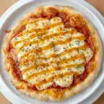 Cozy Hot Honey Ricotta Pizza with creamy cheese, golden crust, and a sweet-spicy finish, styled as one of the most delicious Specialty Pizza Recipes.