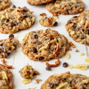 A tray of Kitchen Sink Cookies with gooey chocolate chips and crunchy mix-ins, inspired by Best Kitchen Sink Cookies.