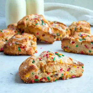 Birthday Cake Scones with colorful sprinkles and a soft vanilla glaze, styled as a fun Birthday Cake Scone for a cheerful brunch spread.