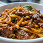Black Pepper Beef Udon served in a glossy noodle bowl, a cozy Beef Recipes idea for a fast and flavorful dinner.