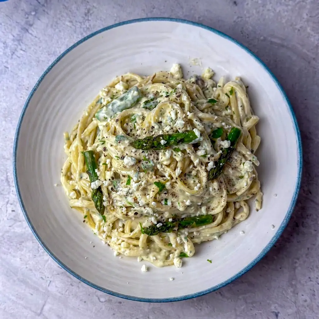 A silky skillet of Creamy Lemon Feta Pasta with herbs and linguine, inspired by a fresh Greek Pasta Recipe.