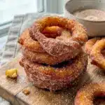 Golden cinnamon apple rings fresh from the pan, styled for a cozy Fall Apple Dessert Preparation moment.