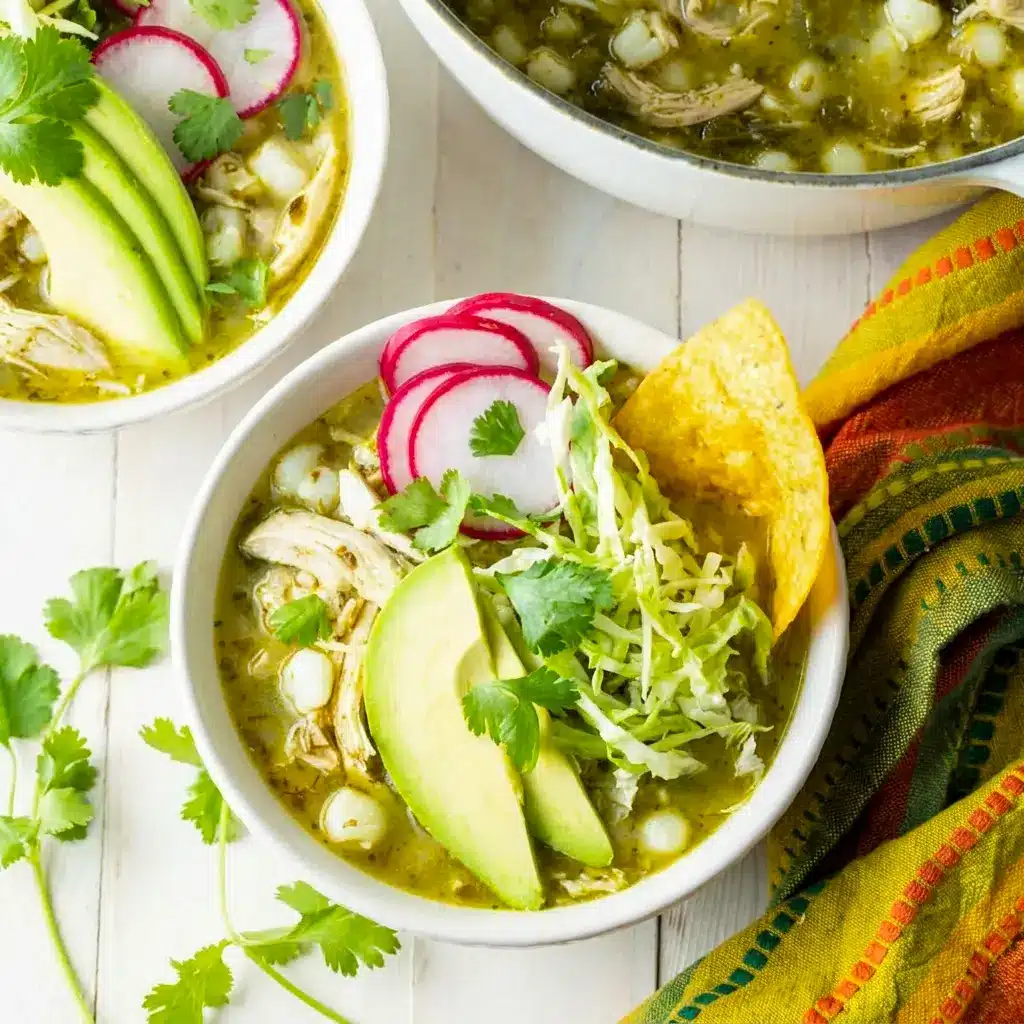 Pozole Verde de Pollo served in a Dutch oven, highlighting a Quick Posole meal with hominy, tomatillos, and tender chicken.
