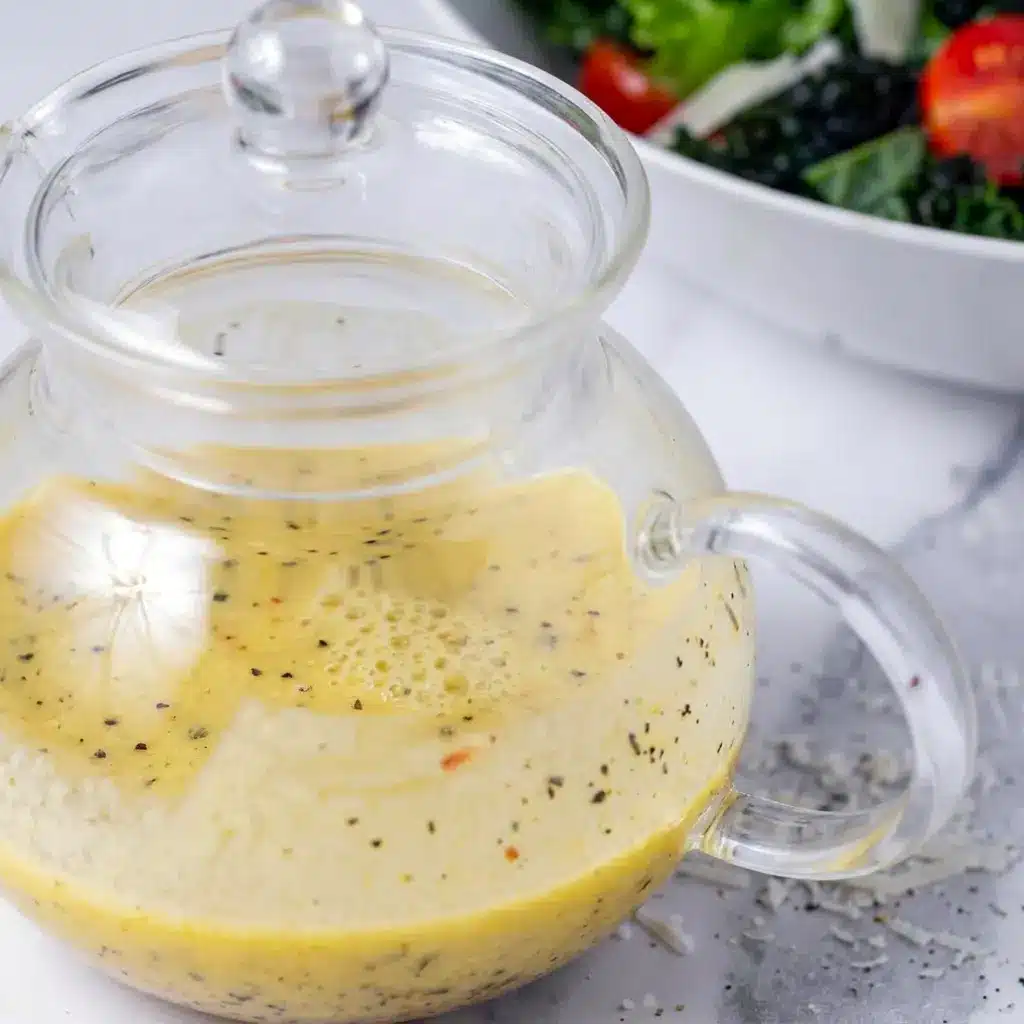 Parmesan Vinaigrette Dressing drizzled over a colorful salad for an easy Italian Parmesan Salad Dressing finish.