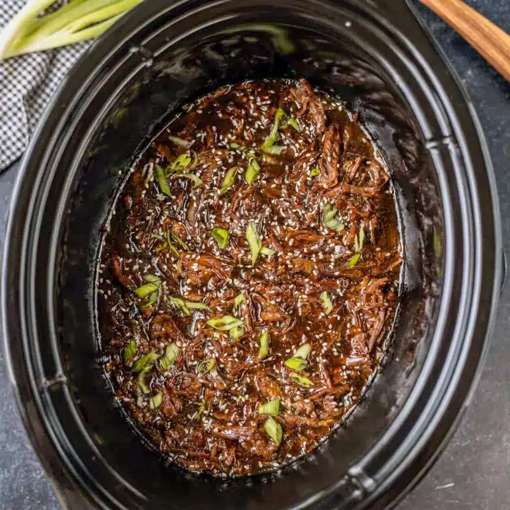 Slow Cooker Korean Beef with tender shredded meat and sesame flavor, a cozy Simple Meat Dinner for busy weeknights.