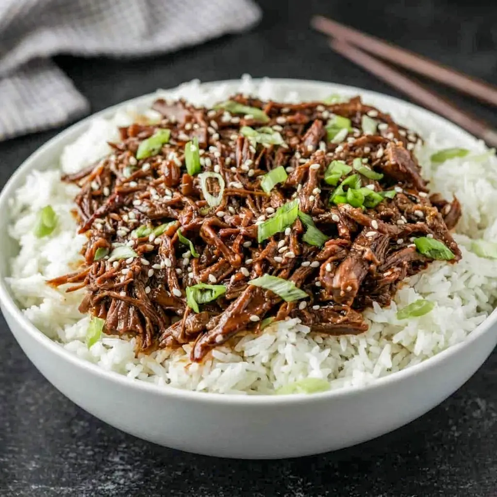 Slow Cooker Korean Beef in a rich soy-garlic glaze, ideal for Easy Dinner Recipes Crockpot Beef that taste like takeout at home.