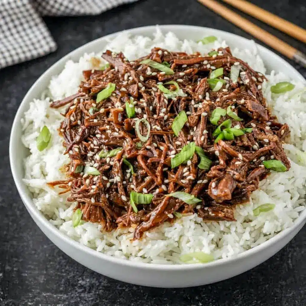 Slow Cooker Korean Beef served with rice and scallions, an easy choice for Weekday Crockpot Meals and Simple Week Night Meals.