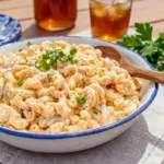 Hawaiian Macaroni Salad served in a creamy bowl as Easy Hawaiian Snacks for a sunny summer cookout table.