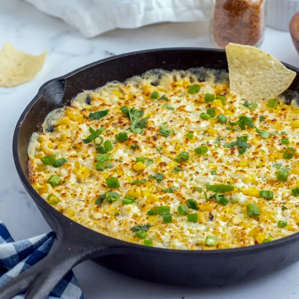 Golden Baked Elote Dip served hot with tortilla chips, perfect Appetizer Snacks for parties.