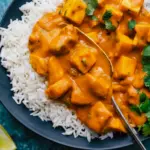 A cozy bowl of Mango Chicken Curry styled as a Not Spicy Curry with creamy sauce and tender chicken.