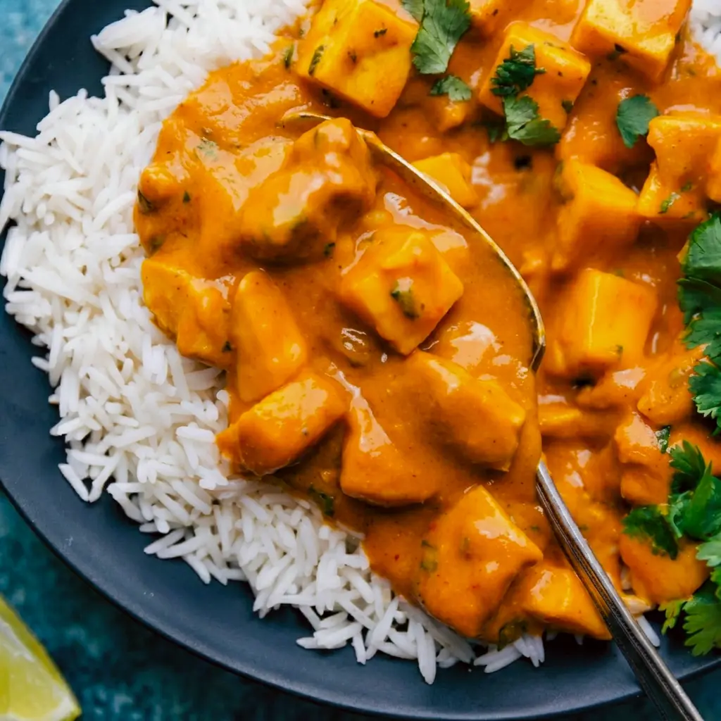 A cozy bowl of Mango Chicken Curry styled as a Not Spicy Curry with creamy sauce and tender chicken.