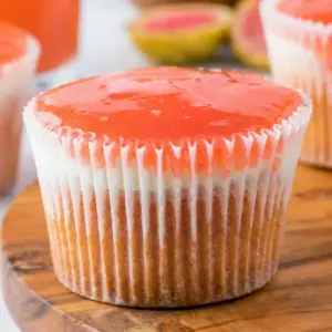 A slice of Mini Hawaiian Guava Cake with glossy pink topping and creamy layers, styled as a beautiful Hawaiian Guava Cake Recipe for dessert lovers.