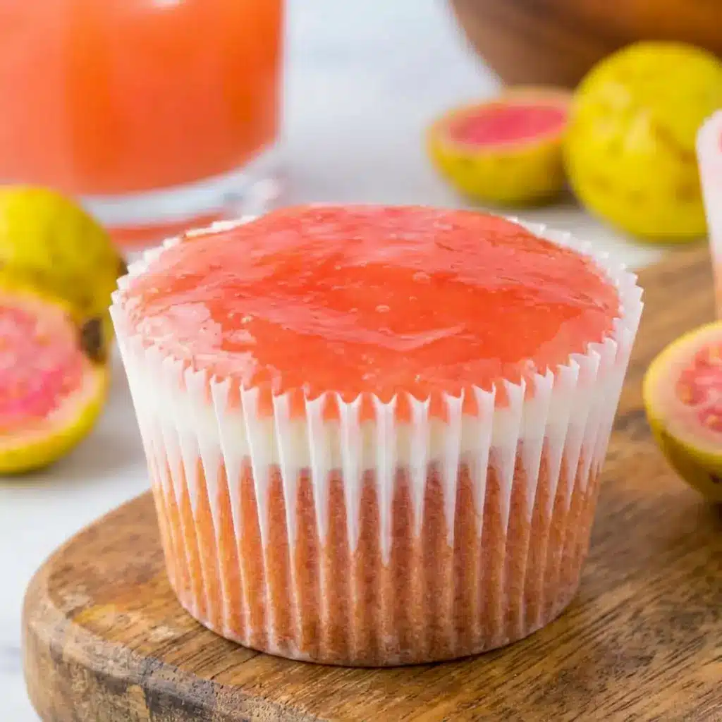 A close-up of Mini Hawaiian Guava Cake with creamy filling and colorful topping, styled as a sweet example of How To Make Guava Cupcakes at home.