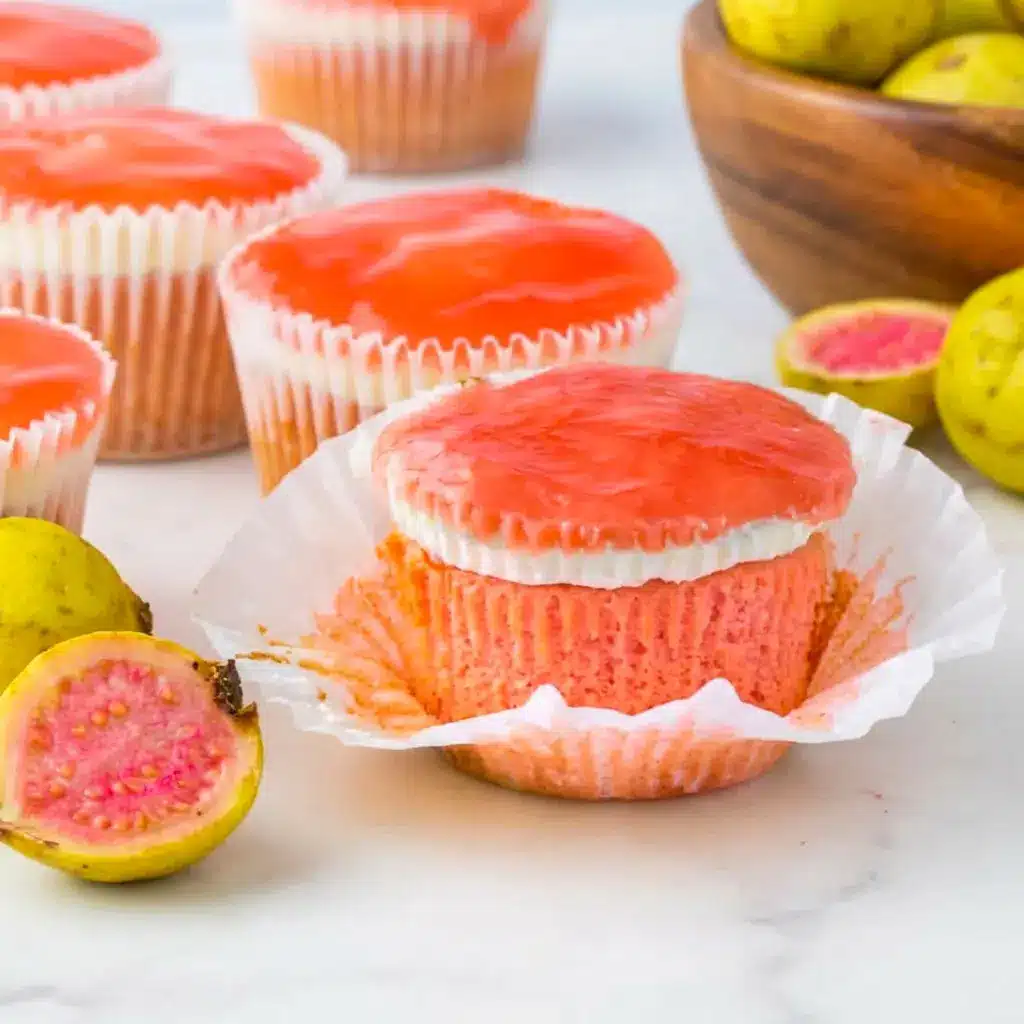 Fresh Mini Hawaiian Guava Cake cupcakes with pink sponge and tropical flair, featured as a fun twist on Tropical Passion Fruit Cupcakes and island-inspired baking.