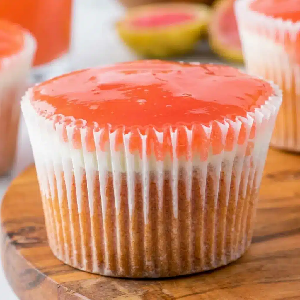 A slice of Mini Hawaiian Guava Cake with glossy pink topping and creamy layers, styled as a beautiful Hawaiian Guava Cake Recipe for dessert lovers.