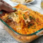 Cheesy White Bean Buffalo Dip baked until bubbly and golden, served with chips for a delicious Easy Party Dips appetizer.