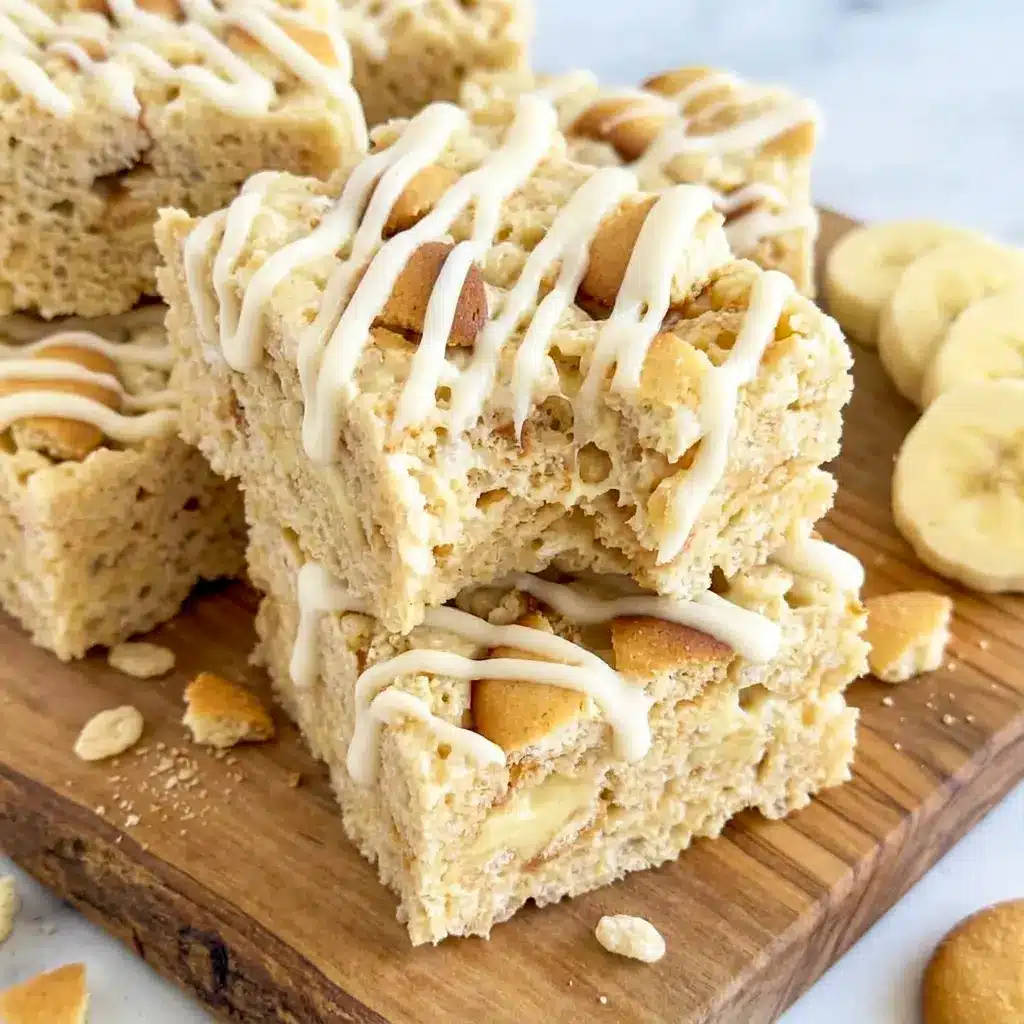 Banana Pudding Rice Krispie Treats stacked on a serving plate, a playful pick for Banana Treats Desserts and lunchbox treats.