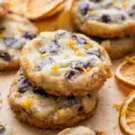 Dark Chocolate Orange Shortbread Cookies with Cookies With Orange on a rustic holiday plate, topped with orange zest and flaky sea salt.
