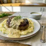 A cozy skillet of Hamburger Steaks in Creamy Dill Sauce served as Dinner With Hamburger Patties for an easy weeknight meal.