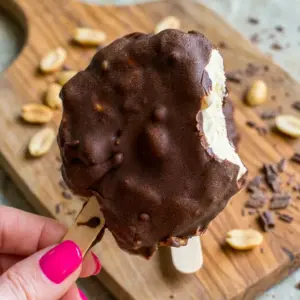 Copycat Dairy Queen Buster Bars stacked on a tray for Healthy Birthday Treat Options with creamy peanut butter filling and chocolate shell.