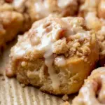 A warm tray of Peach Cobbler Cinnamon Rolls topped with crumb streusel, a cozy Tangzhong Cinnamon Rolls Recipe that bakes up soft and fluffy.