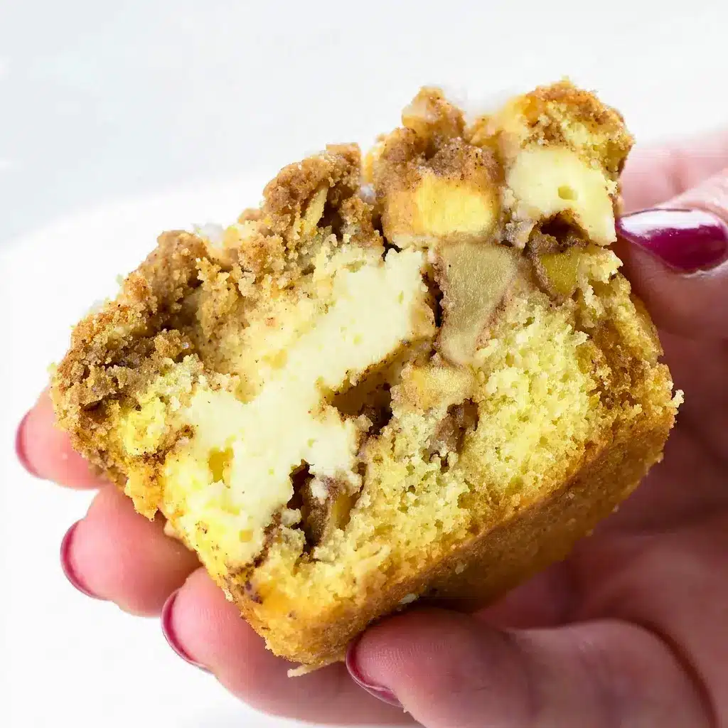 Beautifully layered Apple Crisp Muffins with spiced apples and cheesecake filling, a dreamy take on Cream Cheese Muffins.