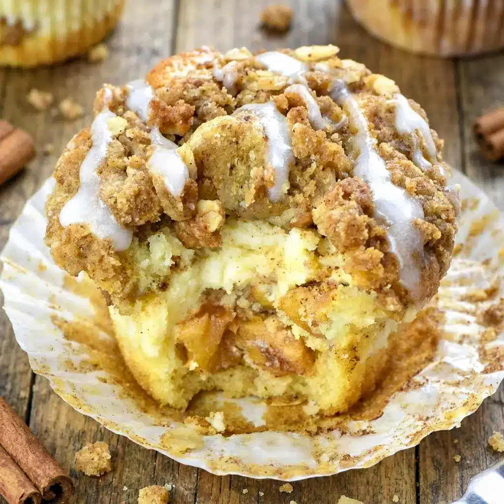 A cozy batch of Apple Crisp Muffins with a creamy center, styled like Apple Cheesecake Muffins and topped with a golden crumb finish.