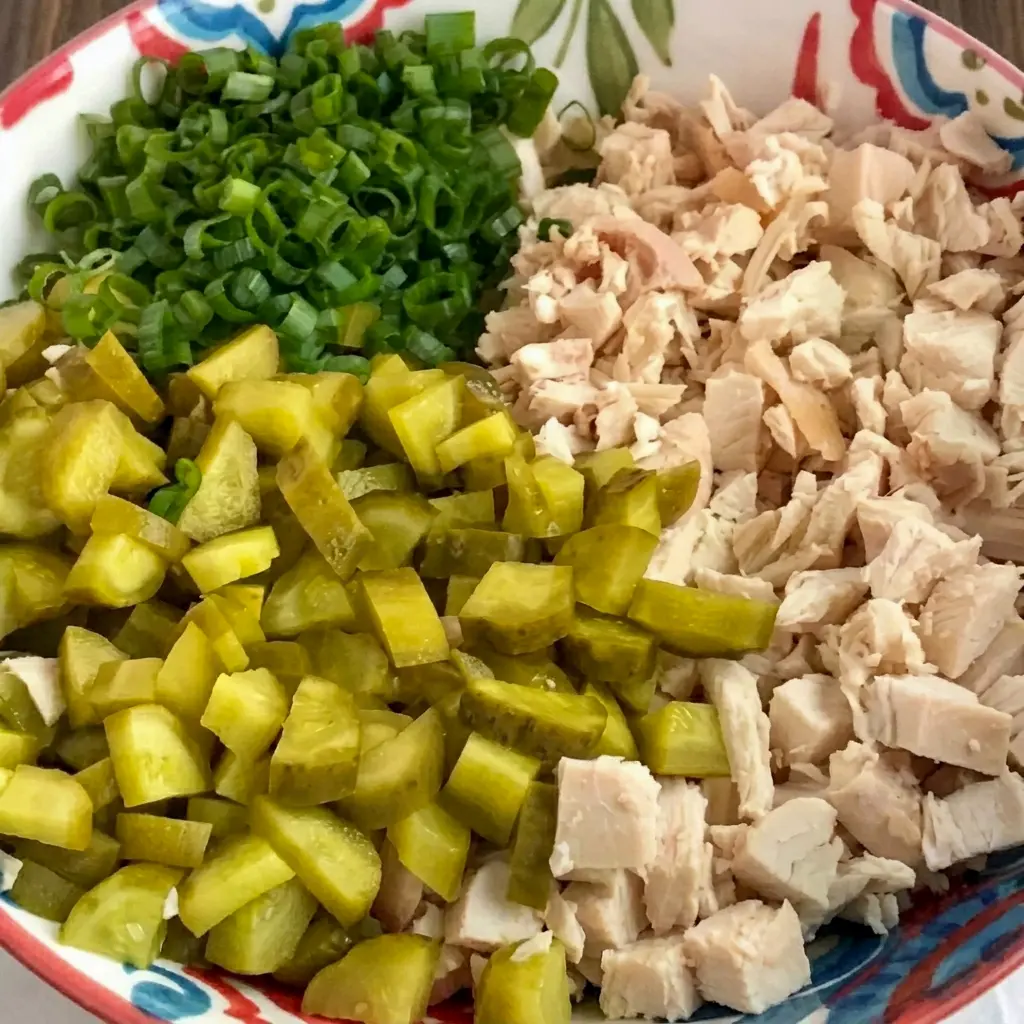 A flavorful bowl of Dill Pickle Chicken Salad with a creamy dressing, one of the easiest Different Ways To Make Chicken Salad for busy days.