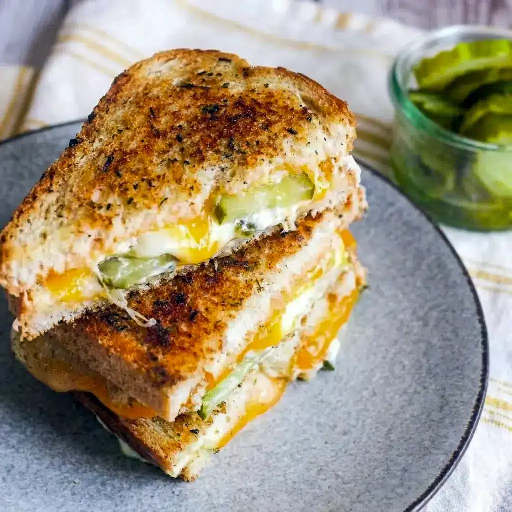 The Dill Pickle Grilled Cheese Sandwich melts over garlicky sourdough, making one of those cozy Dinner Ideas With Sourdough Bread that feels oddly perfect.