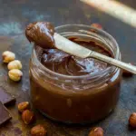 Homemade Nutella spread on toast with a creamy chocolate finish, styled as one of those easy Healthy Snacks Recipes worth saving.
