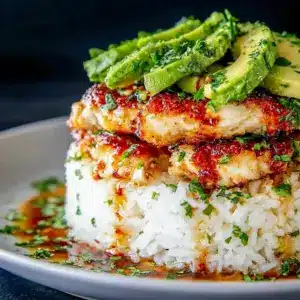 A fresh Honey Lime Chicken and Avocado Rice Stack Recipe for Clean Eating dinner with juicy chicken, avocado, and lime.