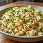 Texas Roadhouse Seasoned Rice is a flavorful Homemade Flavored Rice side that looks warm, buttery, and ready for dinner.