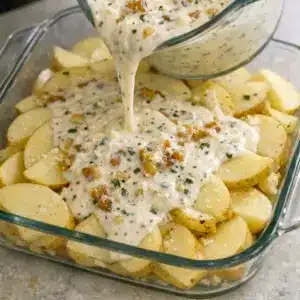 A close-up of Creamy Parmesan Oven-Baked Potatoes with a golden top, perfect for Different Sides For Dinner on a cozy night.