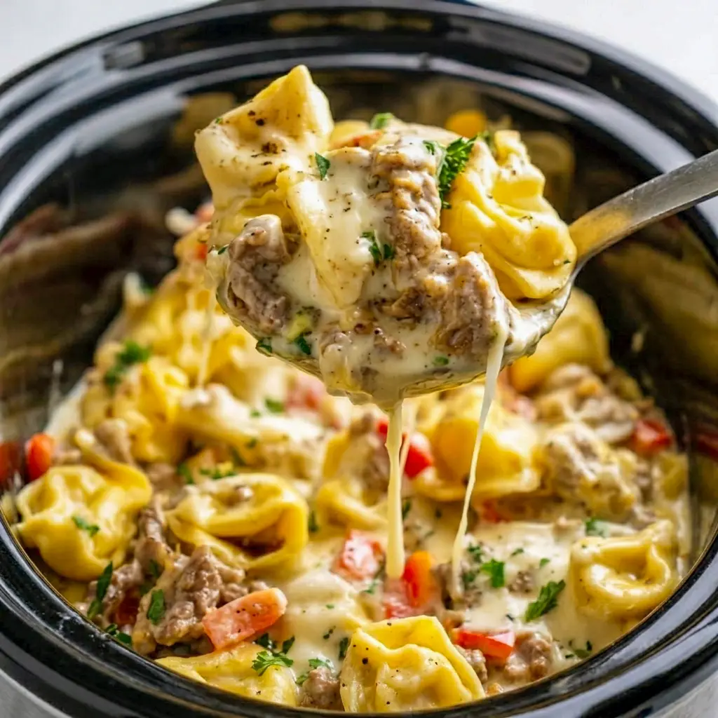 Warm and hearty, Crock Pot Cheesesteak Tortellini in a slow cooker bowl, a comforting choice for Comfort Crockpot Meals and easy weeknight cooking.