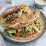 Chicken Caesar Smash Tacos topped with crisp romaine, creamy dressing, and Parmesan, bringing the flavors of a classic Caesar Salad to a handheld meal.