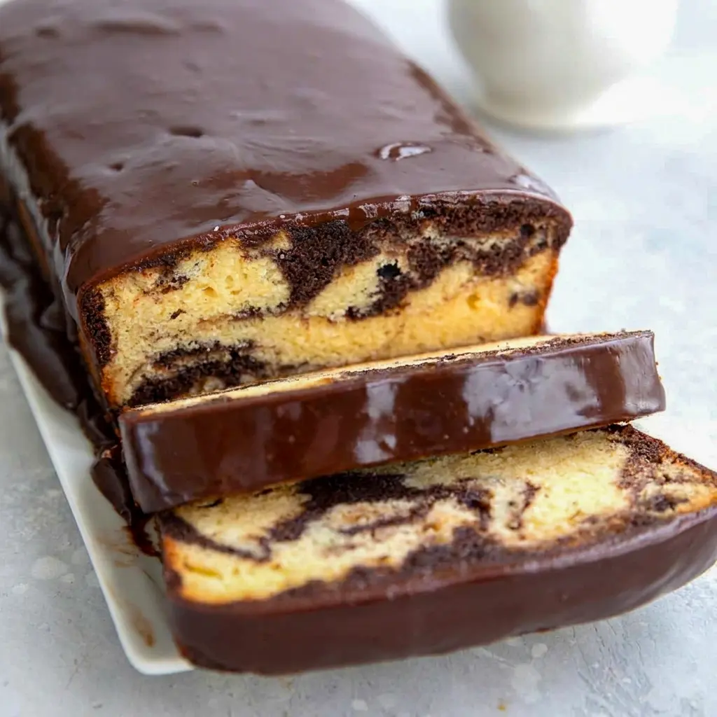 Whole Keto Marble Pound Cake loaf ready to slice, this Gluten free marble pound cake tastes just like the real thing.